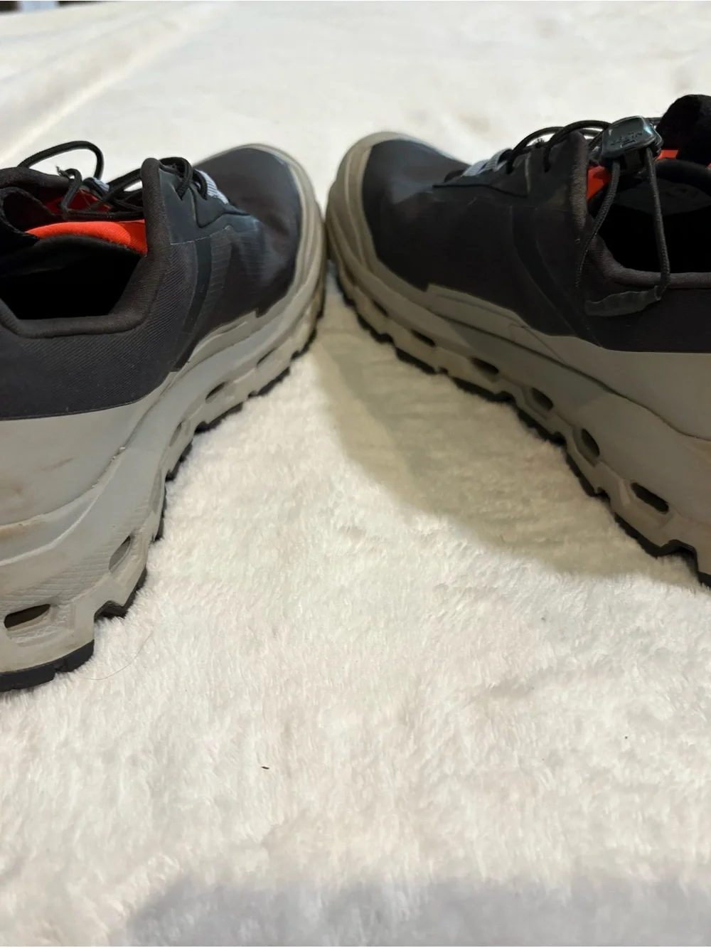 On Running Men's Trail Sneakers in Black, Gray and Red Accent